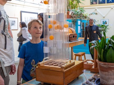 photo of a visitor enjoying an exhibit at Mindport